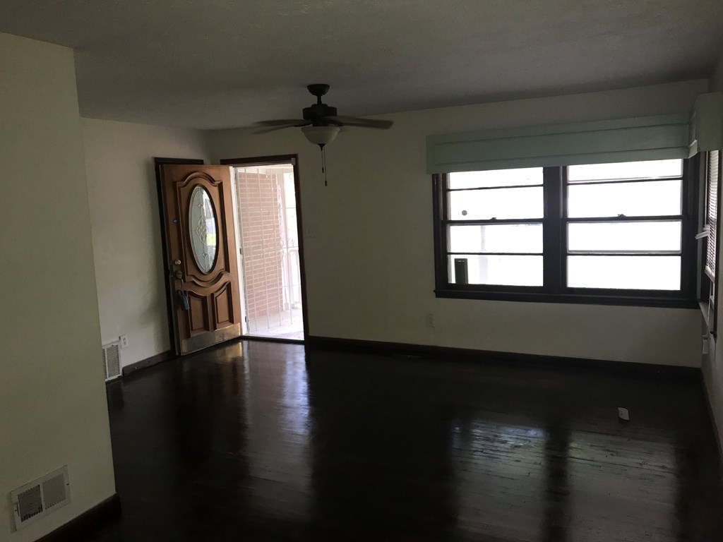 2026 Reese Road Columbus, GA 31907 - Photo 6 of 8 a view of empty room with wooden floor and fan