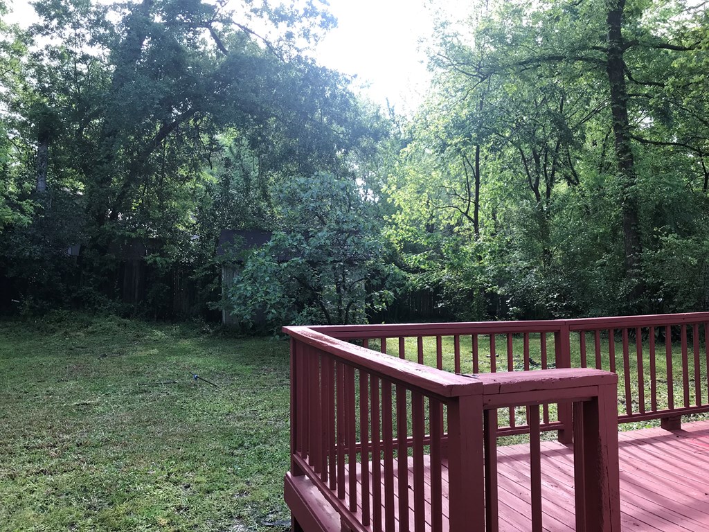 2026 Reese Road Columbus, GA 31907 - Photo 8 of 8 a view of deck with backyard and trees