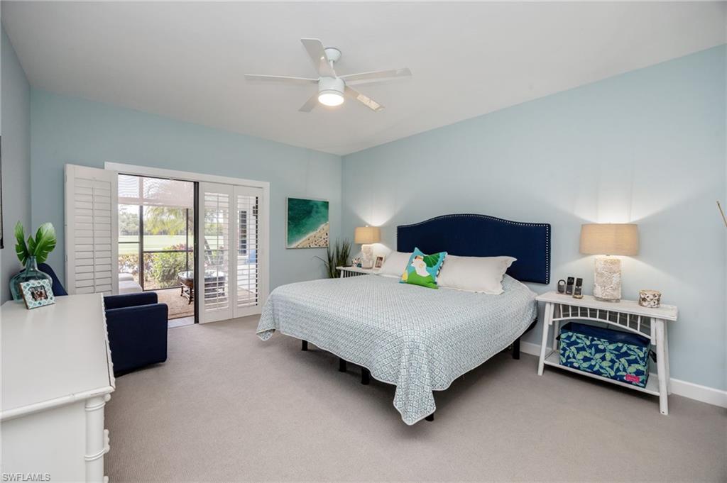 312 Bears Paw Trail Naples, FL 34105 - Photo 14 of 34 a spacious bedroom with a bed and a couch