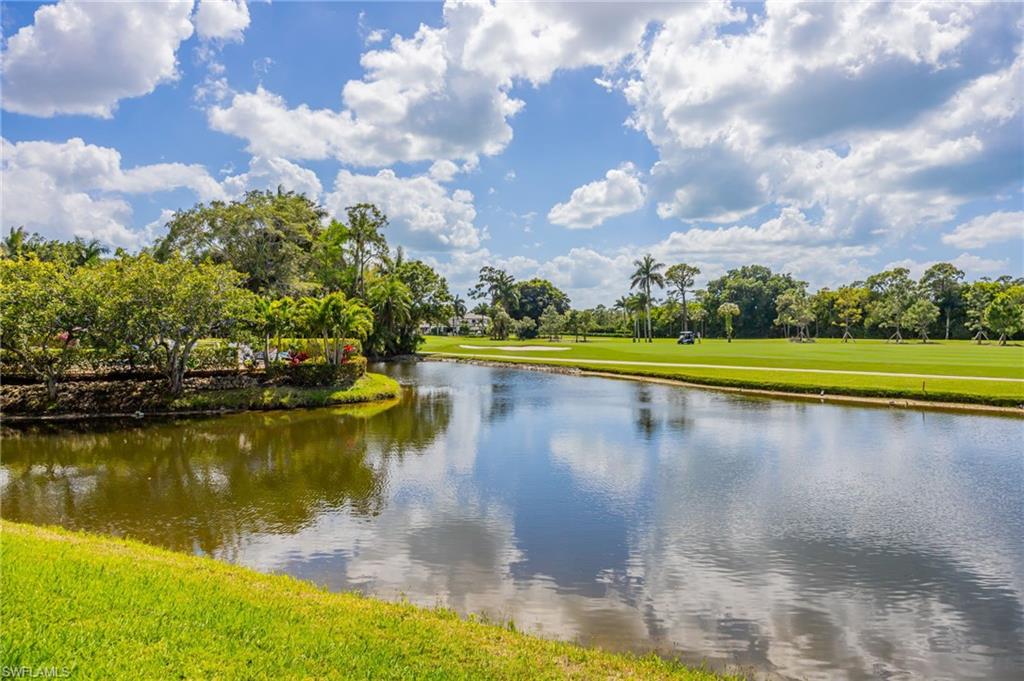 312 Bears Paw Trail Naples, FL 34105 - Photo 21 of 34 a view of a lake with houses in the back