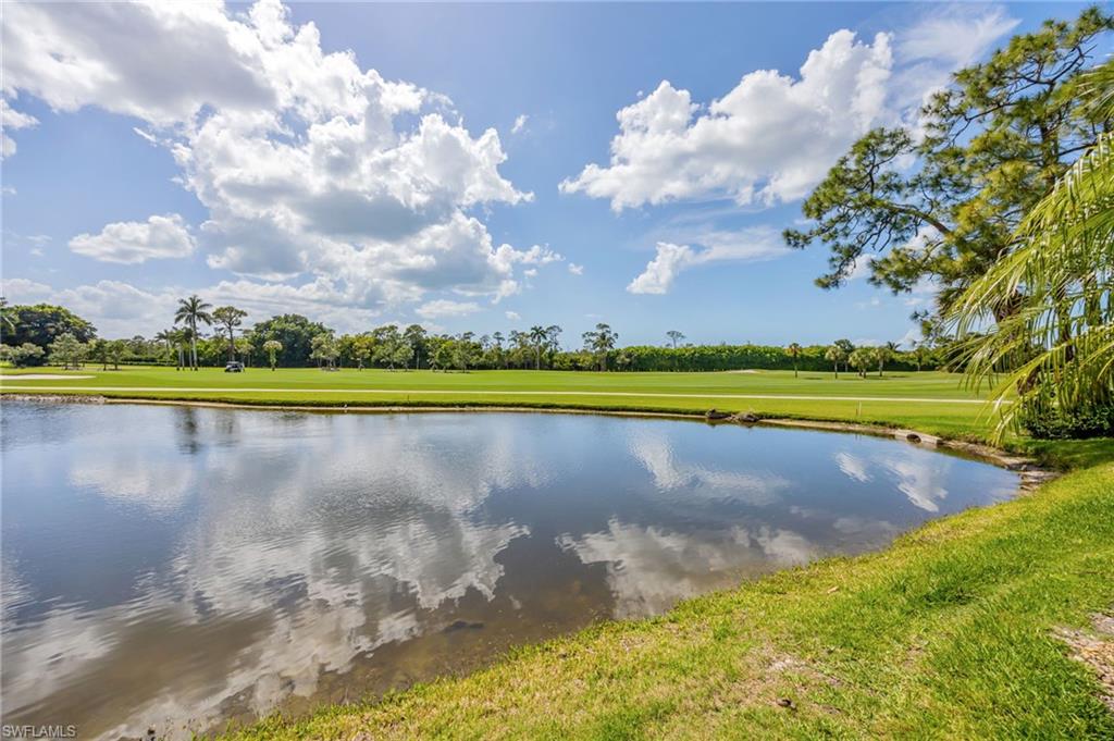 312 Bears Paw Trail Naples, FL 34105 - Photo 22 of 34 a view of a golf course with a lake