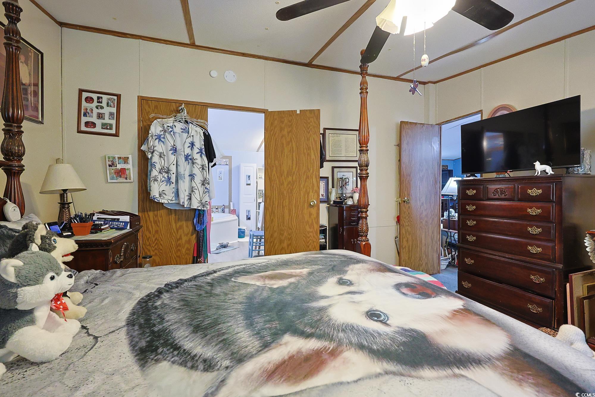 1522 Cove Lane Murrells Inlet, SC 29576 - Photo 12 of 33 Bedroom with ornamental molding and a ceiling fan