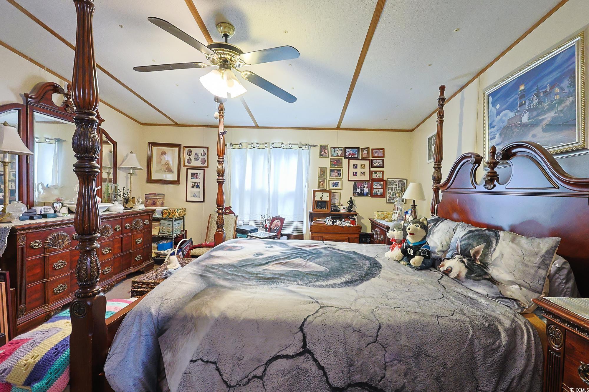 1522 Cove Lane Murrells Inlet, SC 29576 - Photo 13 of 33 Bedroom with crown molding and ceiling fan
