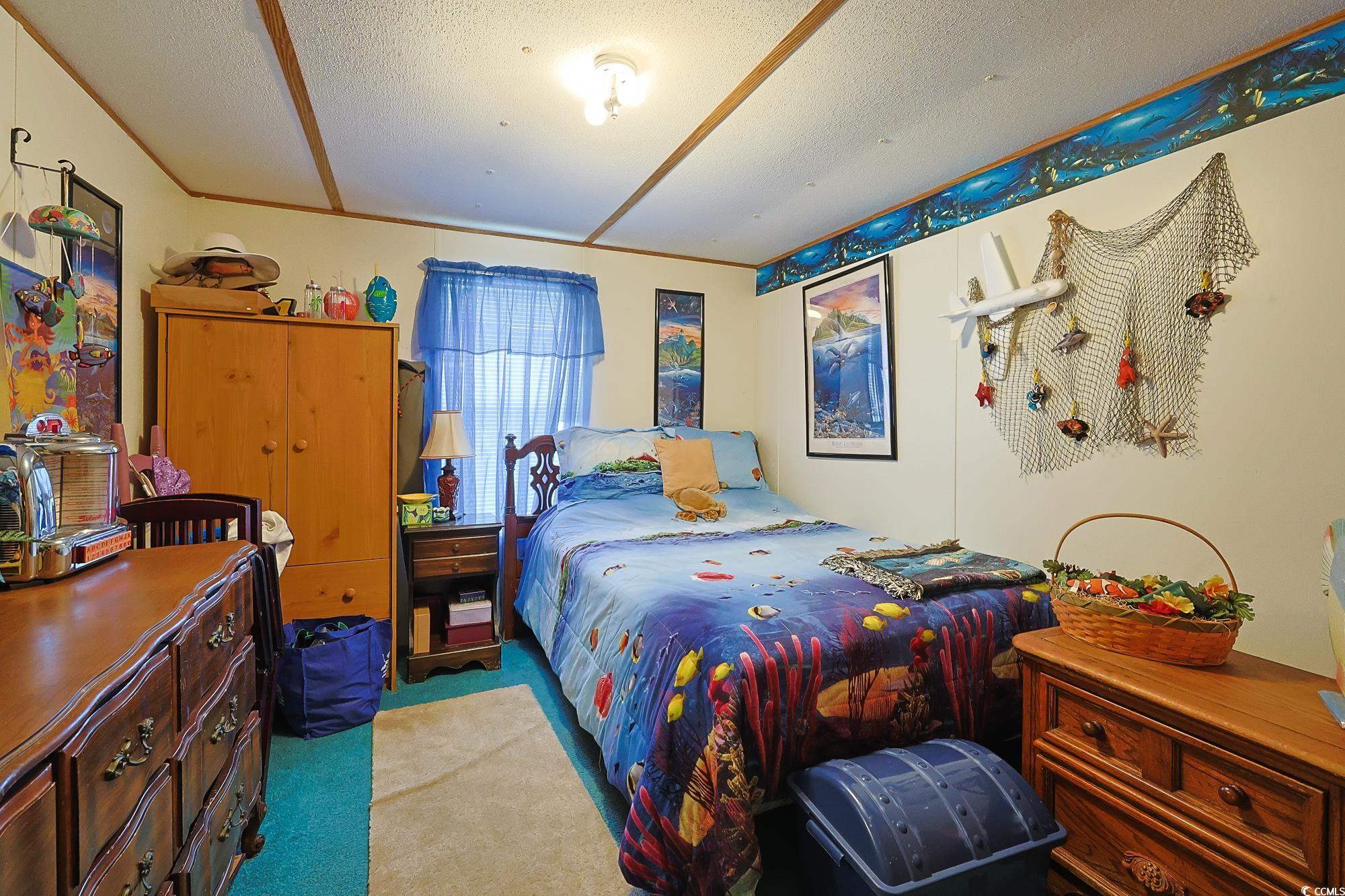 1522 Cove Lane Murrells Inlet, SC 29576 - Photo 22 of 33 Bedroom featuring carpet and a textured ceiling