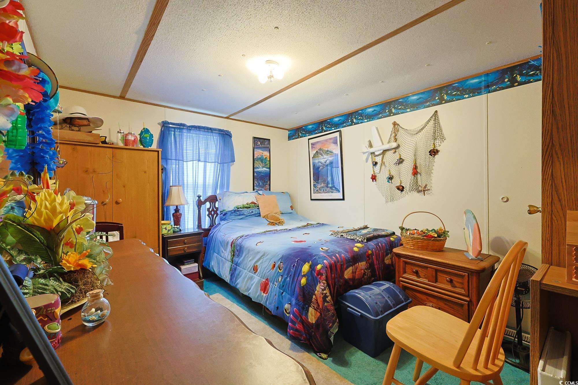 1522 Cove Lane Murrells Inlet, SC 29576 - Photo 23 of 33 Carpeted bedroom with a textured ceiling