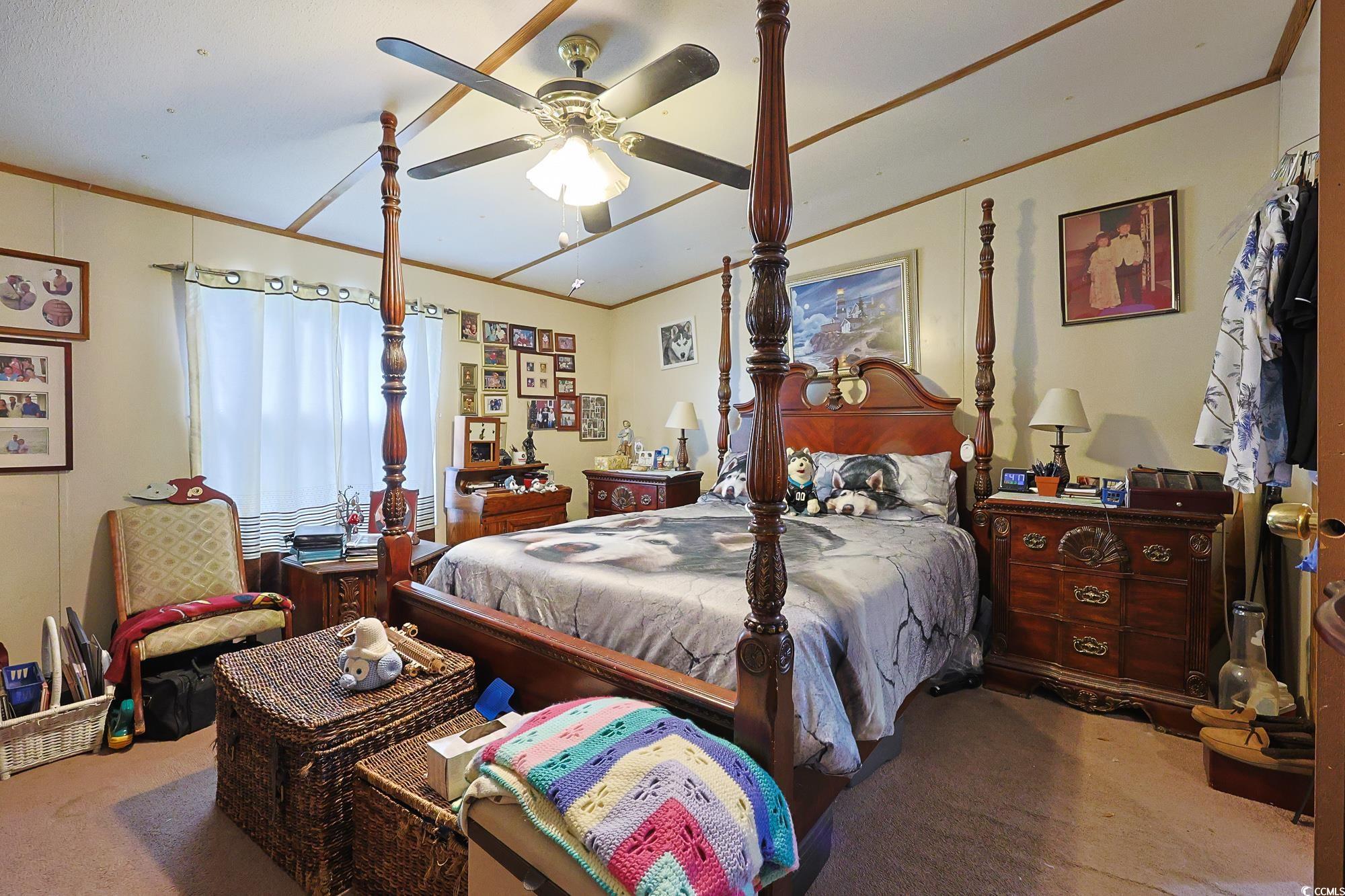 1522 Cove Lane Murrells Inlet, SC 29576 - Photo 10 of 33 Carpeted bedroom featuring crown molding and ceiling fan