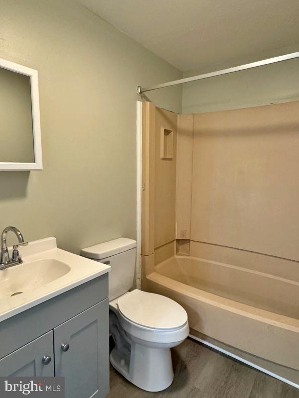 1134 West King Street, Unit 1 York, PA 17404 - Photo 6 of 6 a bathroom with a toilet a sink and a bathtub