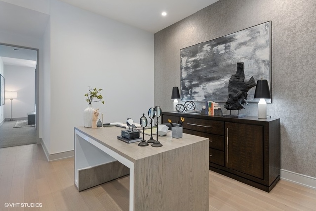 1550 North Clark Street, Unit 302 Chicago, IL 60610 - Photo 11 of 23 a dining room with table and chairs