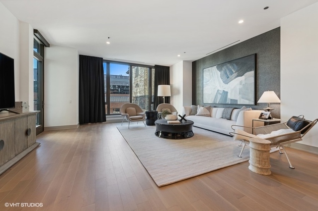 1550 North Clark Street, Unit 302 Chicago, IL 60610 - Photo 3 of 23 a living room with furniture and a flat screen tv