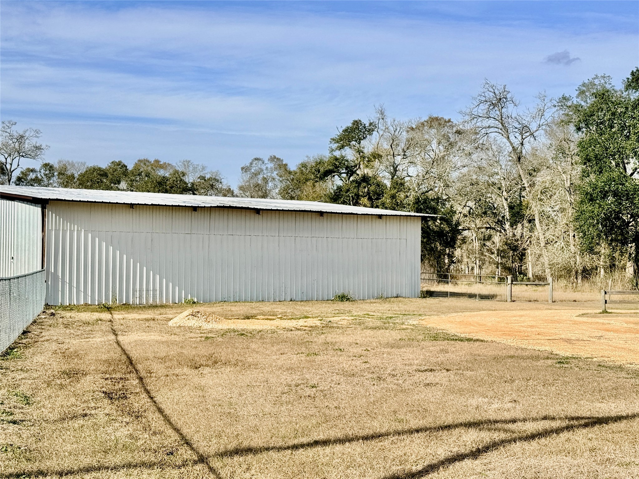6944 County Road 359 Sweeny, TX 77480 - Photo 4 of 17 a view of a backyard of the house