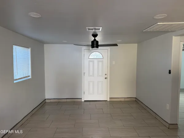 a view of a hallway to rooms