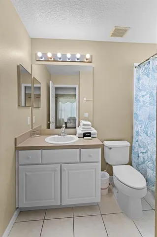 a bedroom with two beds and painted walls