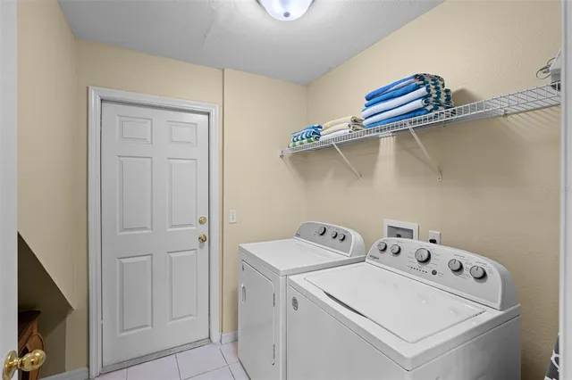 a reading room with furniture pool table and a projector