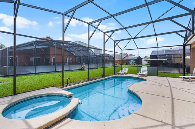 a view of a house with backyard and porch
