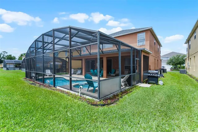 an aerial view of a houses with a city street