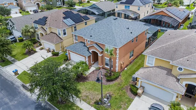 a aerial view of a house with a yard