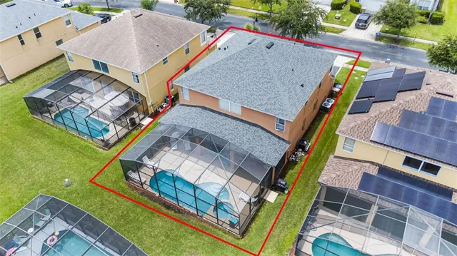 an aerial view of a house with a garden