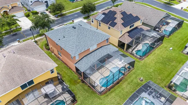 a view of a swimming pool with a table and chairs