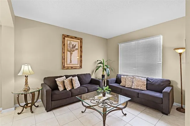 a living room with furniture and a table