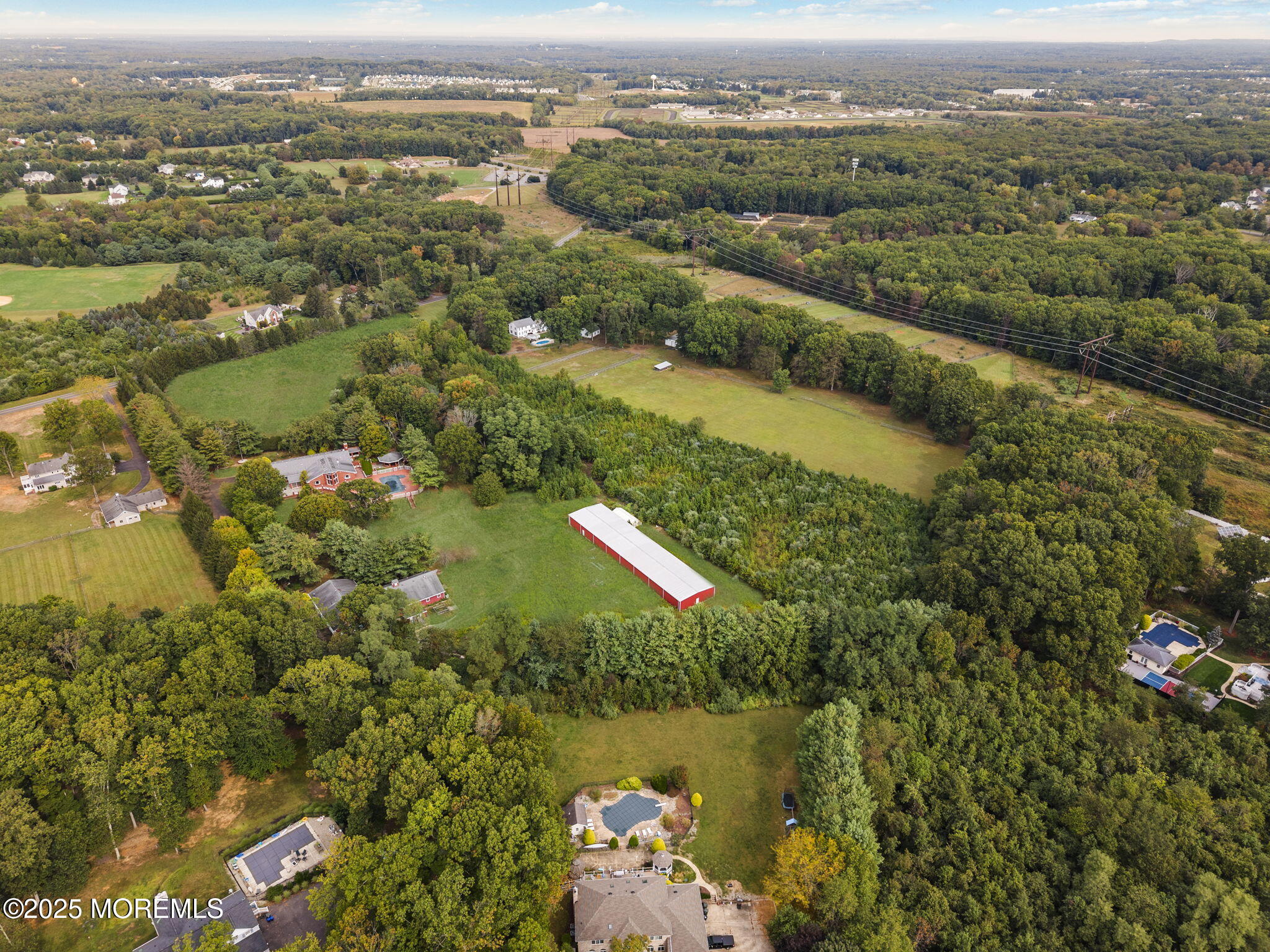 19-23 Roberts Road Millstone Township, NJ 08535 - Photo 22 of 118 an aerial view of residential houses with outdoor space and lake view
