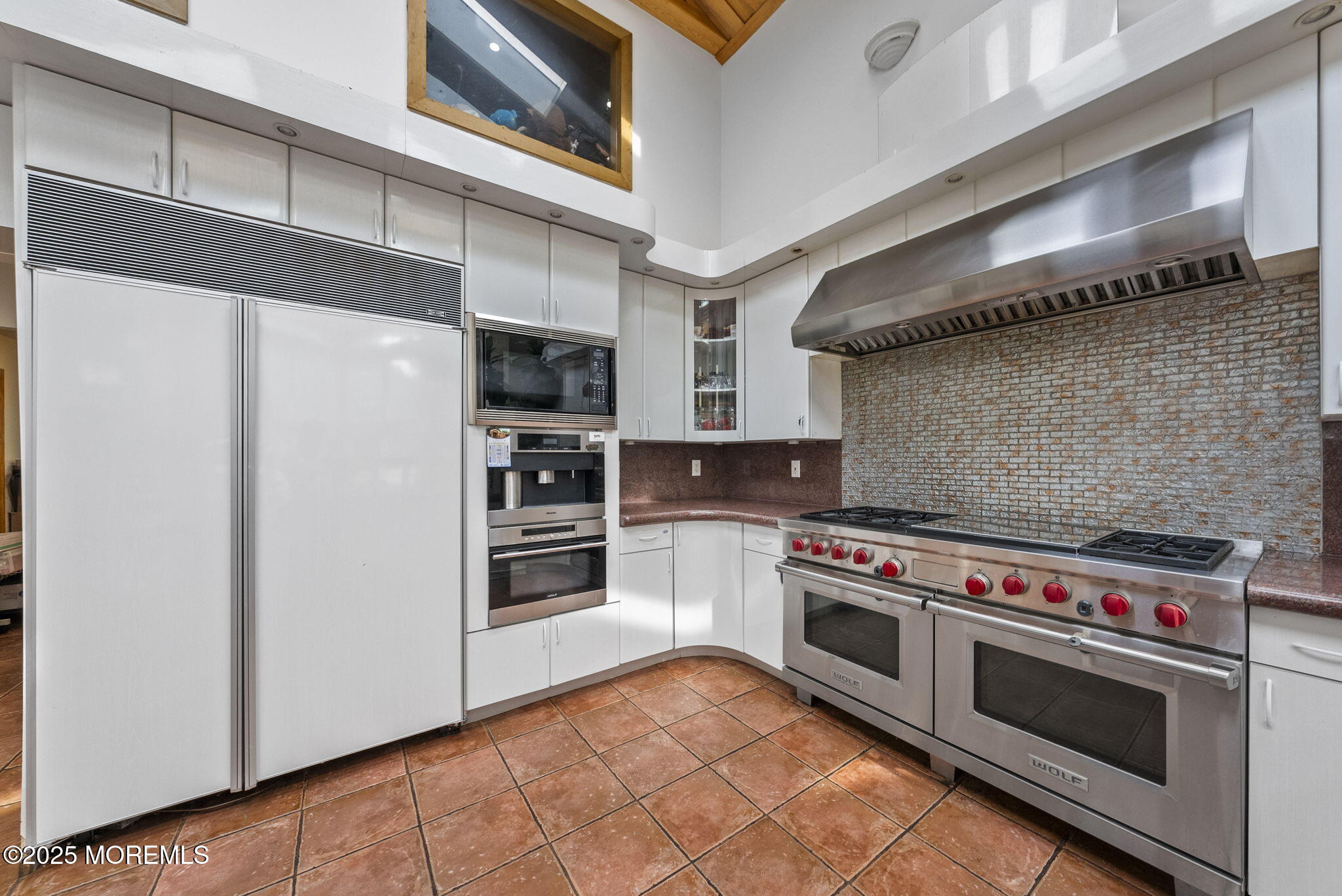 19-23 Roberts Road Millstone Township, NJ 08535 - Photo 37 of 118 a kitchen with stainless steel appliances a stove a microwave and a refrigerator