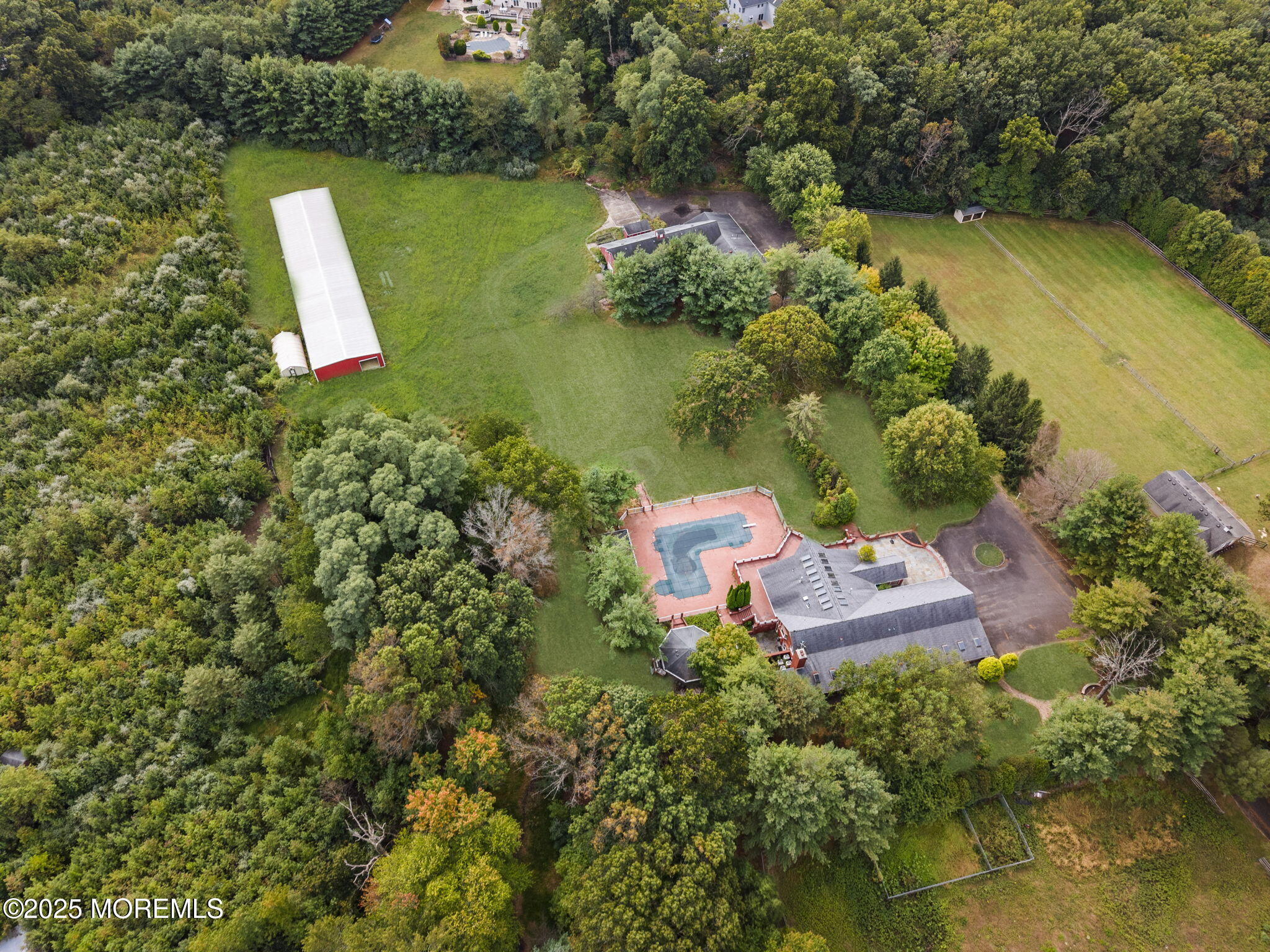 19-23 Roberts Road Millstone Township, NJ 08535 - Photo 4 of 118 an aerial view of a house with a yard and lake view