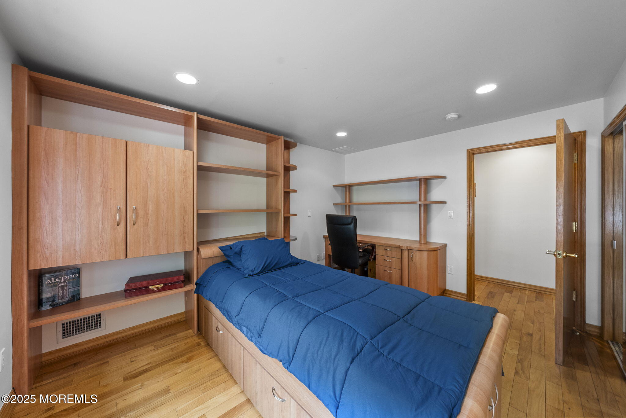 19-23 Roberts Road Millstone Township, NJ 08535 - Photo 56 of 118 a bedroom with a bed and a dresser with wooden floor