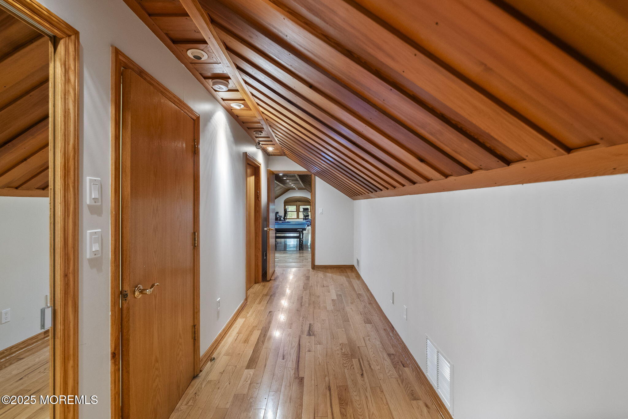 19-23 Roberts Road Millstone Township, NJ 08535 - Photo 74 of 118 a view of a hallway with wooden floor and staircase