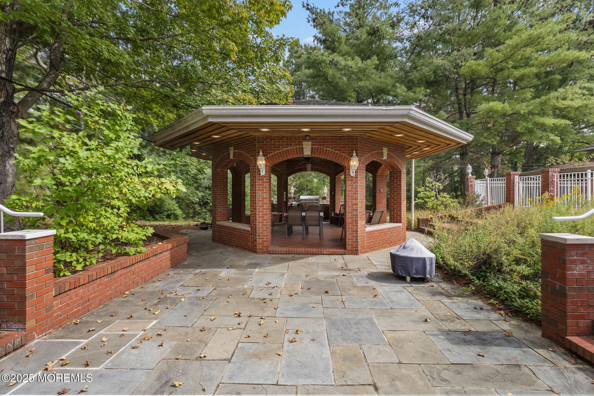 19-23 Roberts Road Millstone Township, NJ 08535 - Photo 78 of 118 a view of a patio with table and chairs under an umbrella