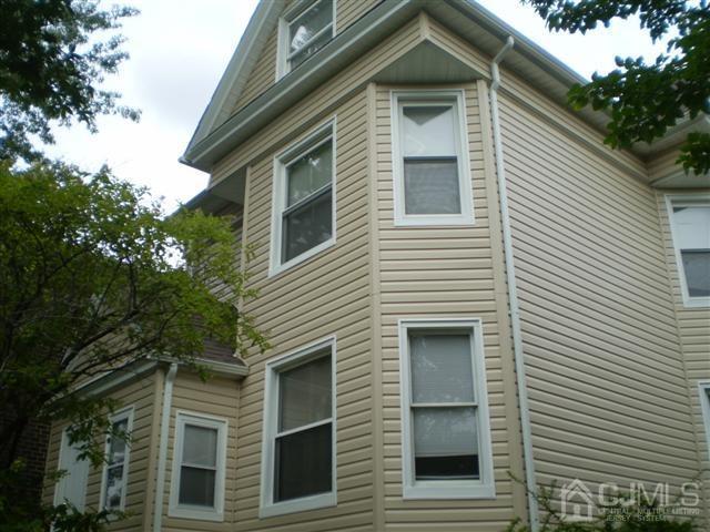 574 Scotland Road Orange, NJ 07050 - Photo 1 of 10 a view of a house and a window