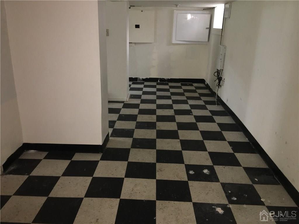 574 Scotland Road Orange, NJ 07050 - Photo 7 of 10 a black and white checkered floor