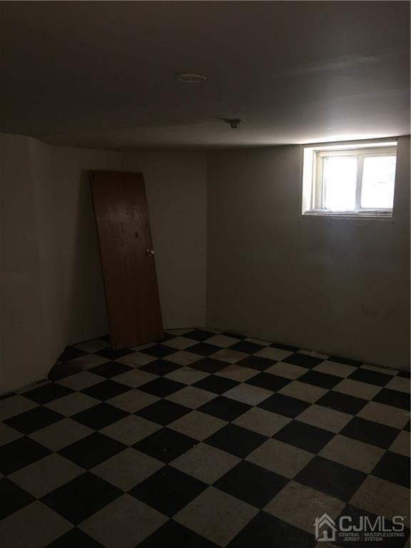 574 Scotland Road Orange, NJ 07050 - Photo 8 of 10 a black and white checkered floor