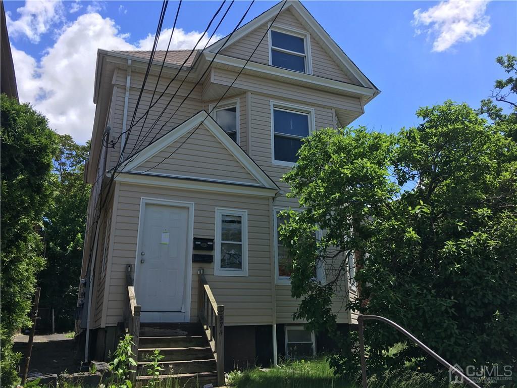 574 Scotland Road Orange, NJ 07050 - Photo 10 of 10 a front view of a house with a yard