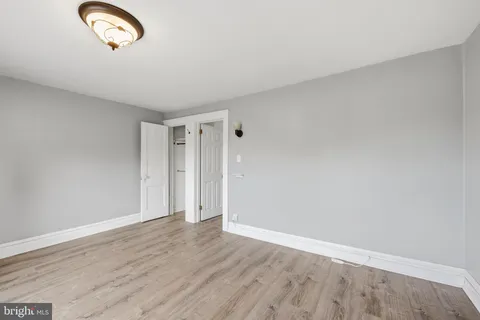 a room with gym equipment and view of living room
