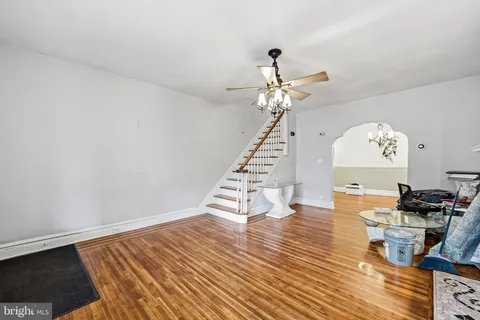 a view of a living room and wooden floor