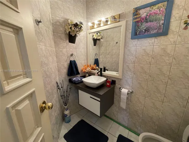 a living room with furniture city view and large windows