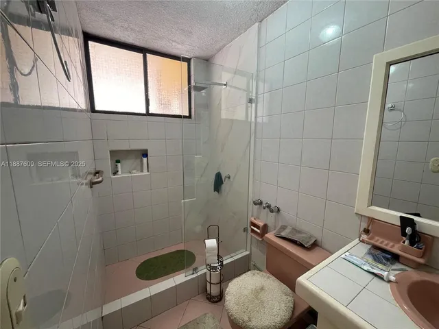 a dining room with furniture window and wooden floor