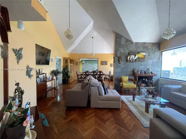 a view of a room with furniture and a window