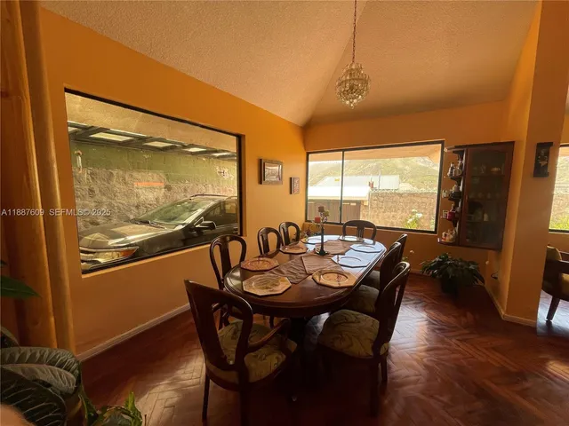 a view of a wooden door and a floor to ceiling window