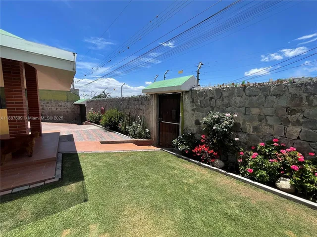 a swimming pool with outdoor seating