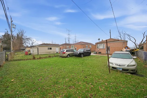 a view of yard with car parked