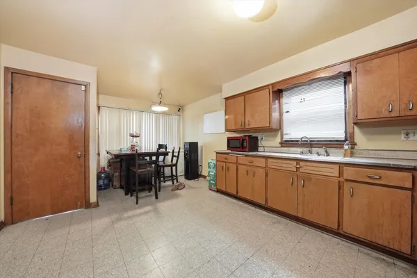 a view of a dining room with furniture and window