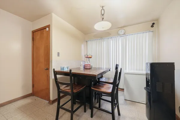a kitchen with granite countertop a refrigerator stove top oven and sink