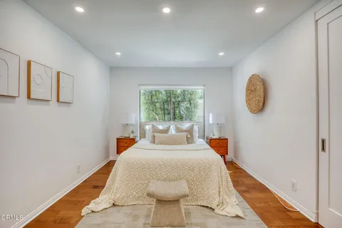 a bed room with a bed and a window