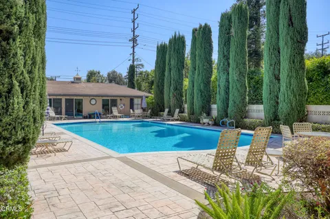 a view of swimming pool with a patio