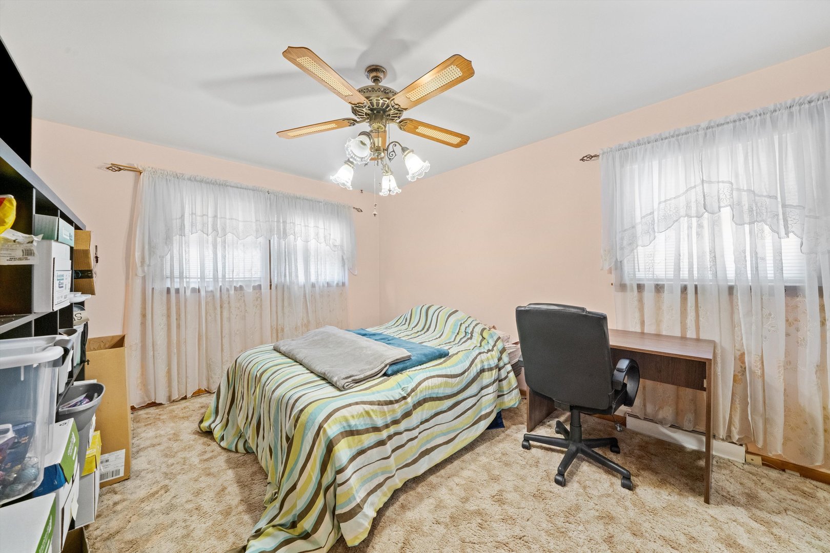 8819 North Wisner Street, Unit 1 Niles, IL 60714 - Photo 8 of 21 a view of a workspace with furniture and a window