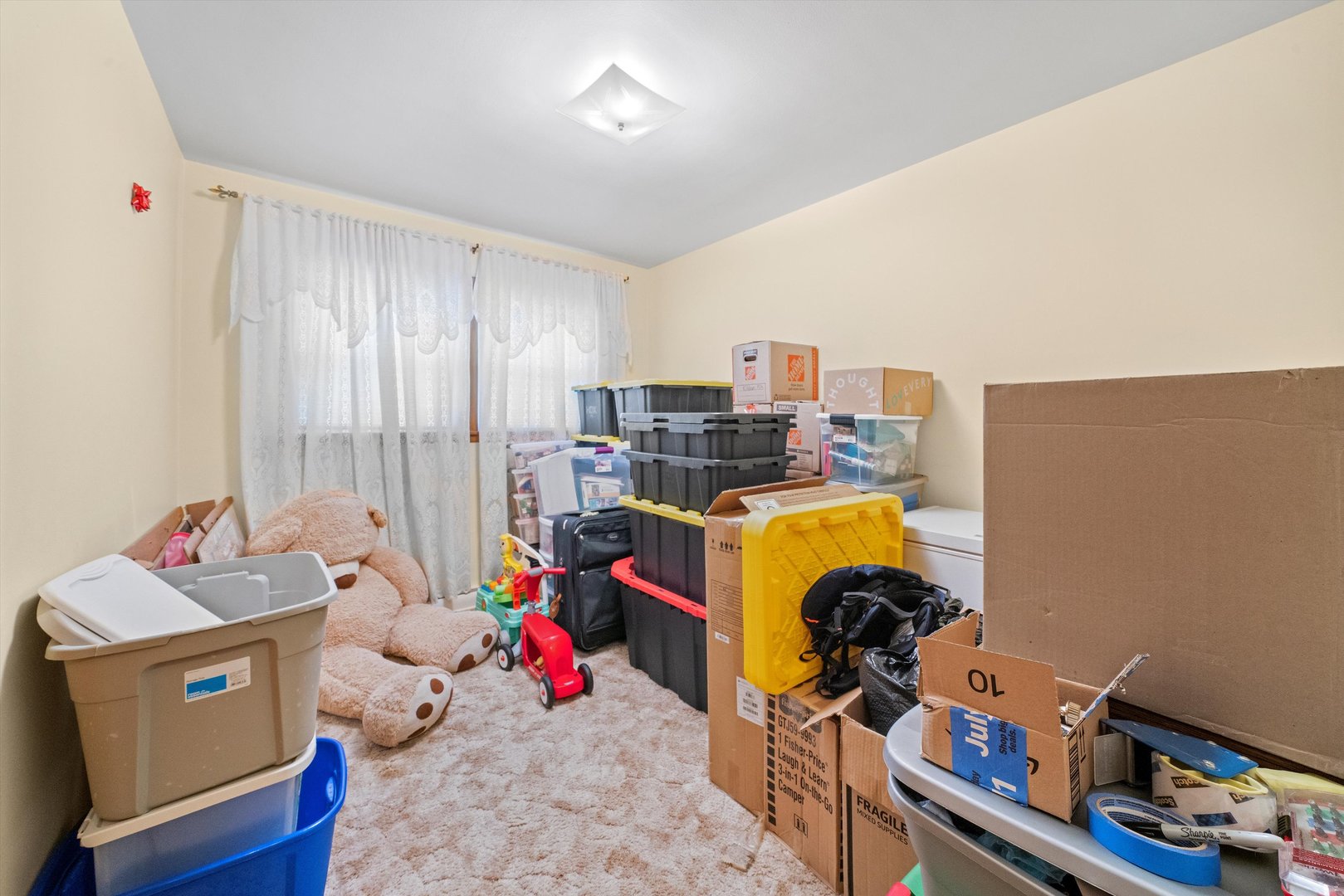 8819 North Wisner Street, Unit 1 Niles, IL 60714 - Photo 10 of 21 a bed room with a bed and toys