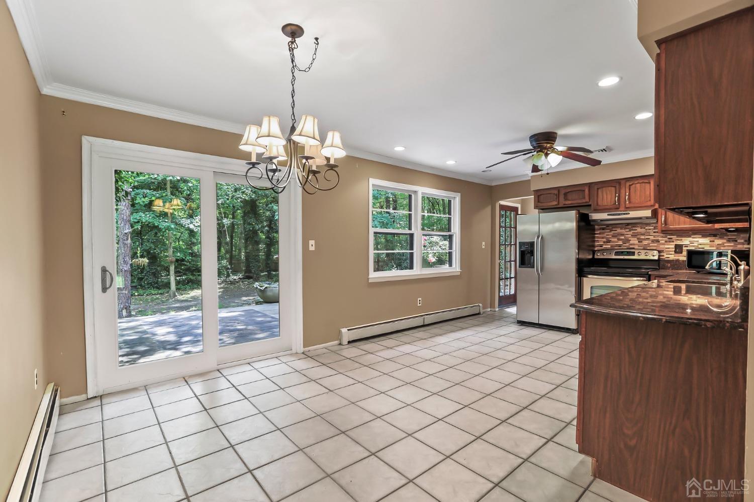 111 Old Forge Road Monroe Township, NJ 08831 - Photo 13 of 39 a view of a room with kitchen and dining area windows