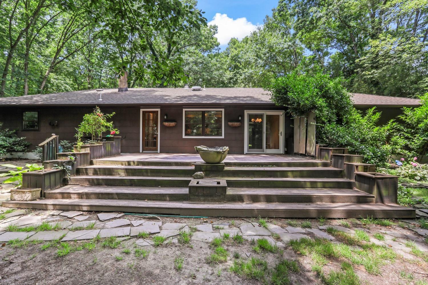 111 Old Forge Road Monroe Township, NJ 08831 - Photo 31 of 39 a front view of a house with a garden