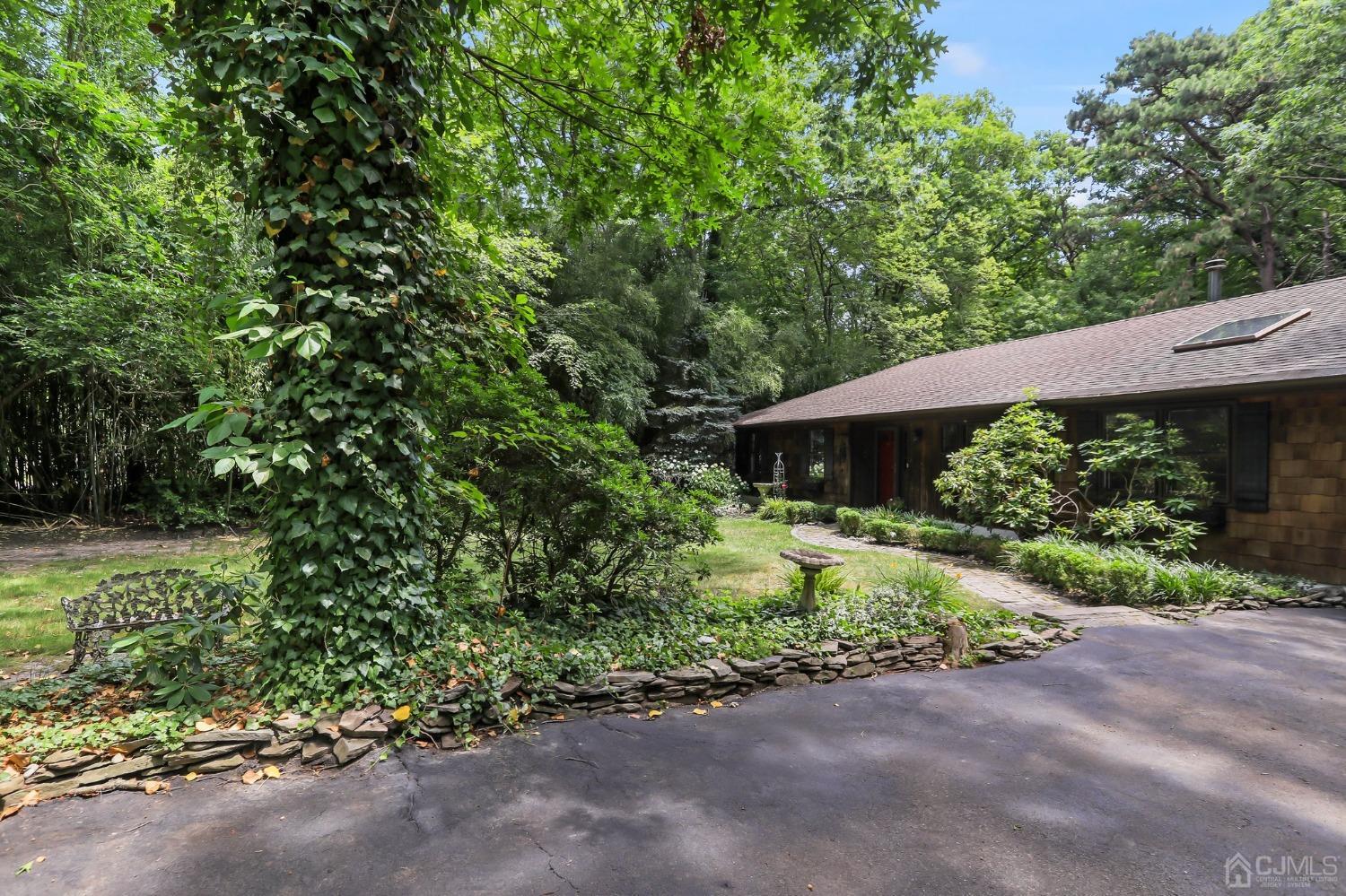 111 Old Forge Road Monroe Township, NJ 08831 - Photo 35 of 39 a backyard of a house with a yard and outdoor seating
